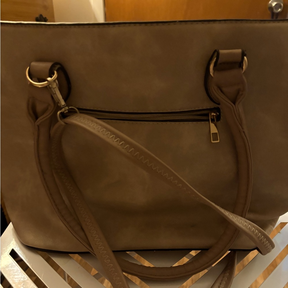 Here is a regular duffel bag with  short and long straps.natural color